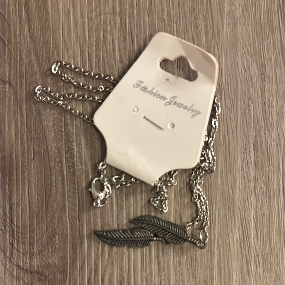 NWT Elegant Silver Necklace with Feather Charms